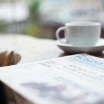 selective focus photography of business newspaper